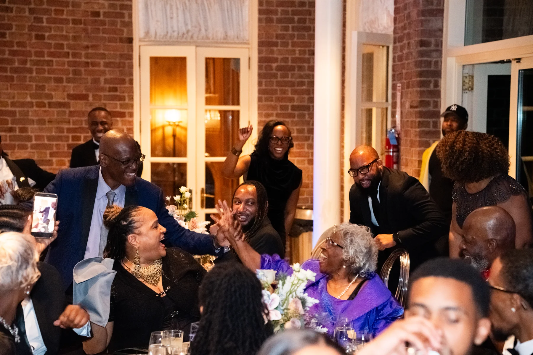 Guests celebrating together around a table at the ABLE Legacy Gala