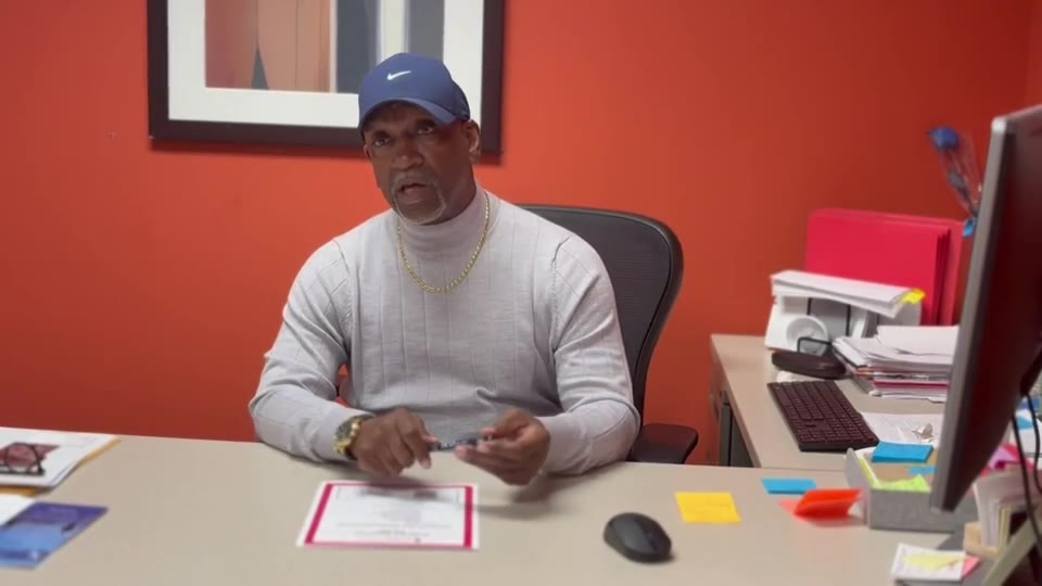 Mr. Marvin at his desk at the EMBRACE Resource Center